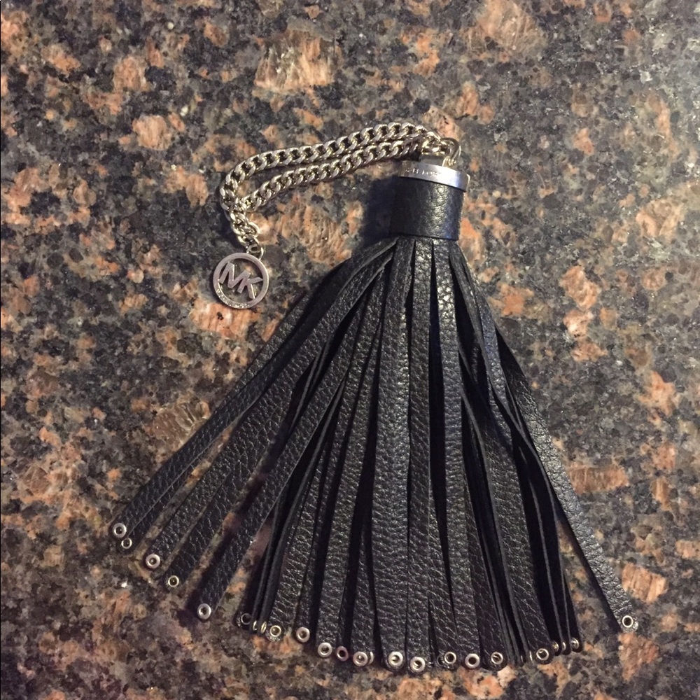 Michael Kors black “Brooklyn” grommet tassel